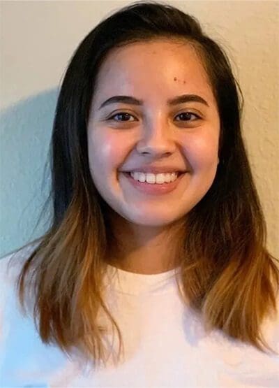 A young woman smiling for the camera.