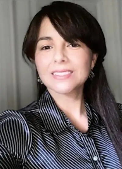 A woman with long hair and wearing a black shirt.