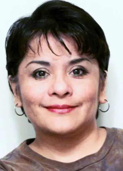 A woman with short hair and big eyes.